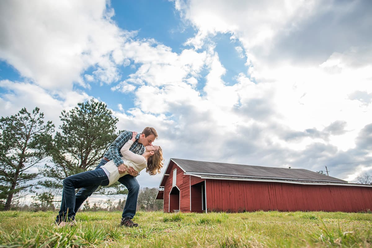 Engagement pictures at a red barn | perfect dip kiss pose for a couple