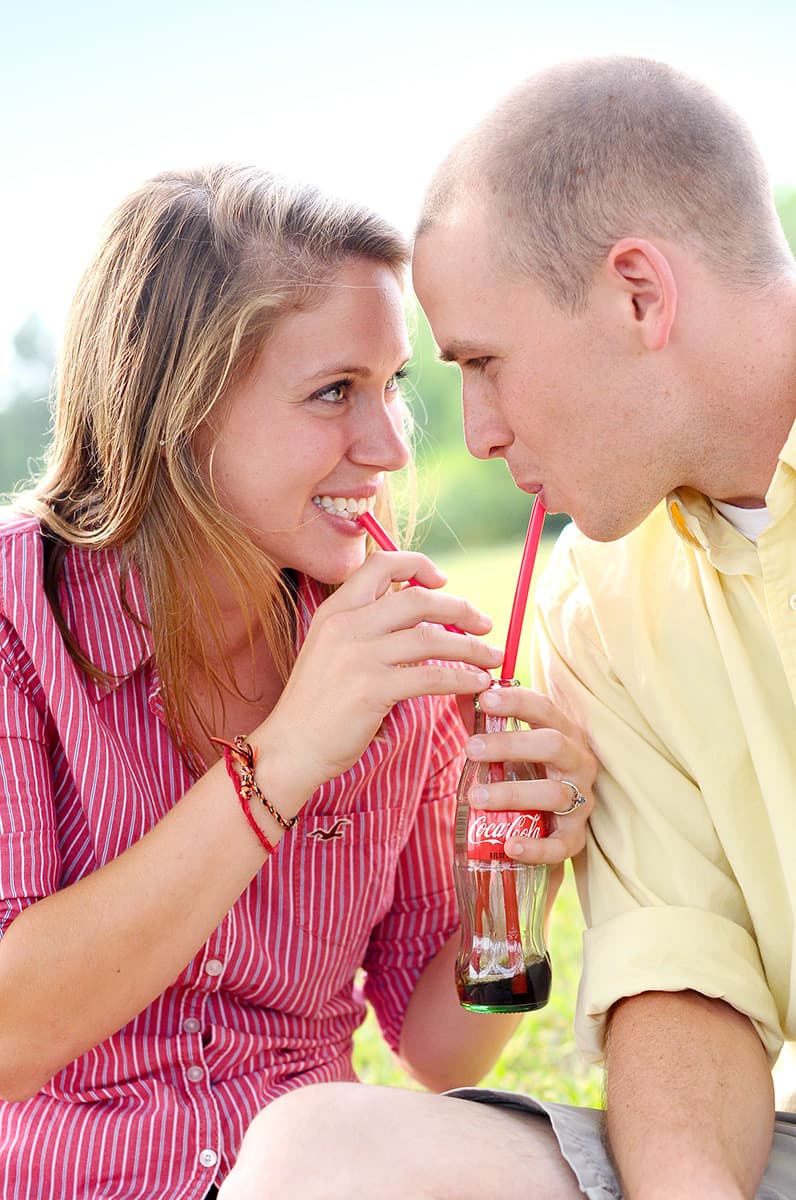 Vintage Coca-Cola engagement picture sipping coke from straws