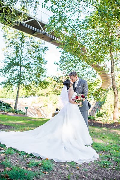 Wedding photographer in Greenville, SC | Falls Park on the Reedy, under the Liberty Bridge